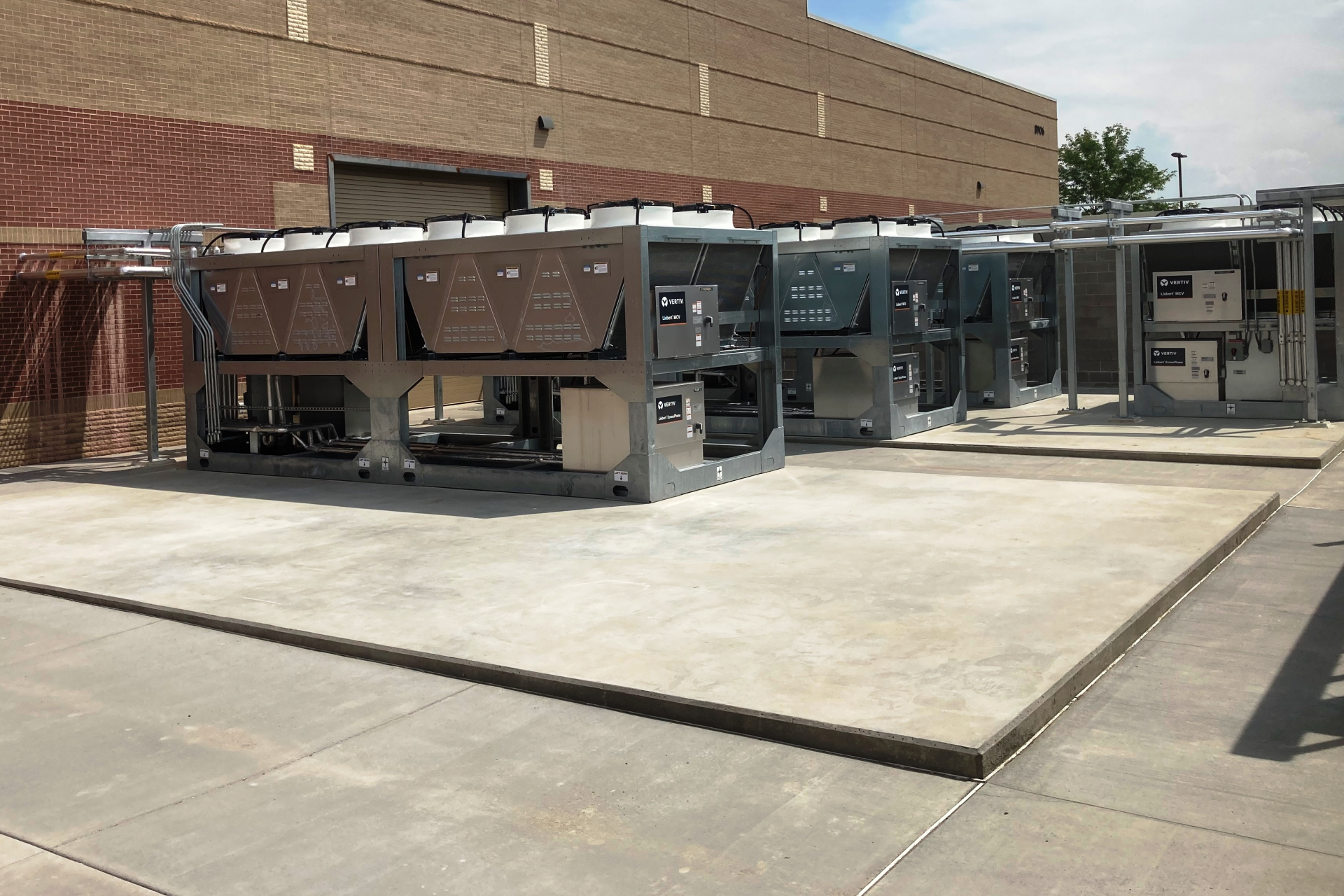 Skid mounted modular dry coolers located within mechanical yard